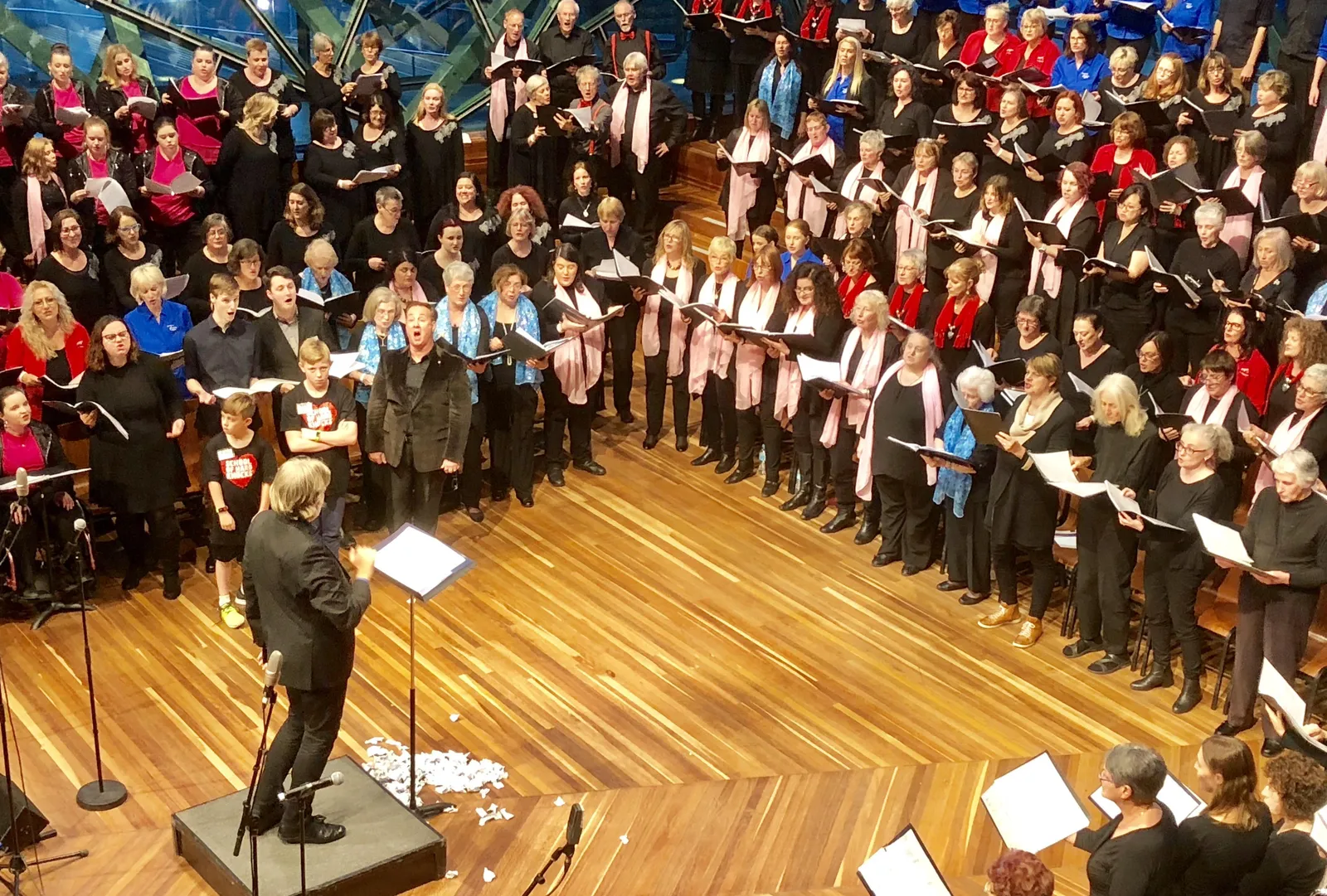 Antony Pitts conducting massed choirs in concert